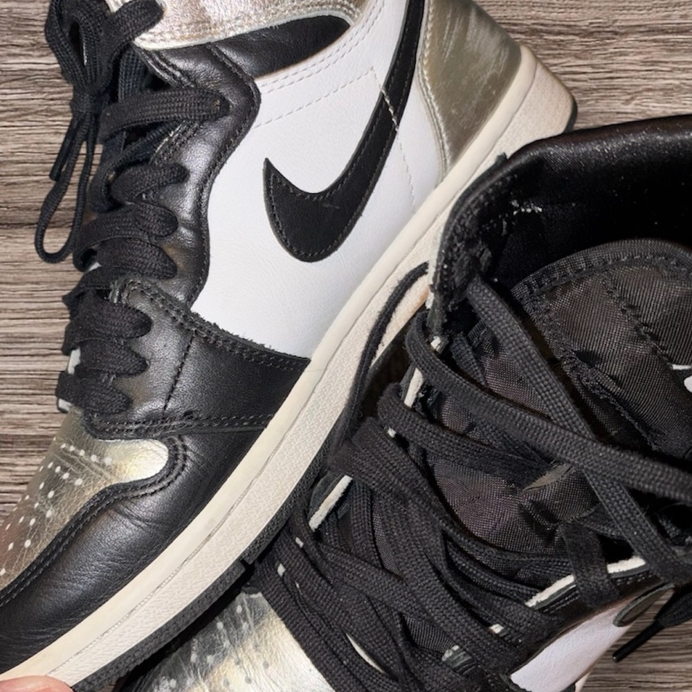 Nike Black, White, and Silver High-Tops view all photos